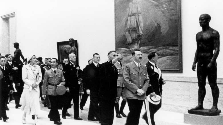 Hitler and nazis walking through art exhibition