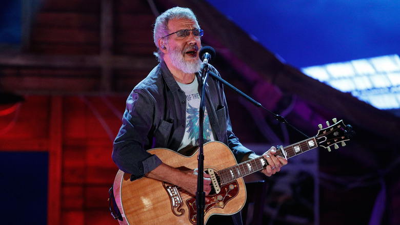 Yusuf/Cat Stevens playing guitar