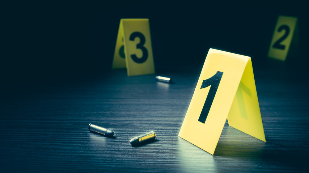 crime scene with bullets and yellow numbers