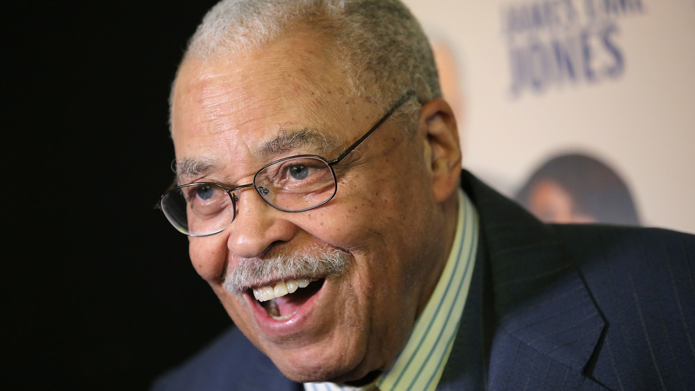 James Earl Jones suit glasses smiling