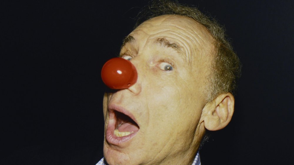 Mel Brooks red nose black background