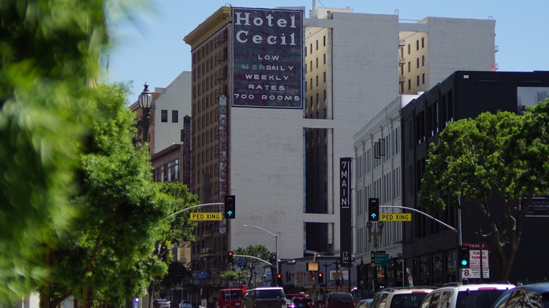 Trees blow in front of the Cecil Hotel