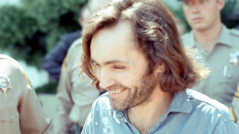 Charles Manson surrounded by police