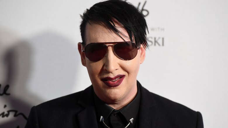 marilyn manson glasses smirking