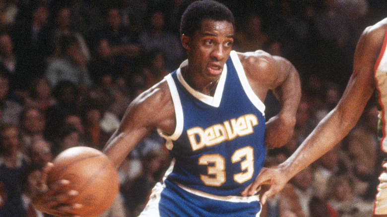 David Thompson driving forwards basketball