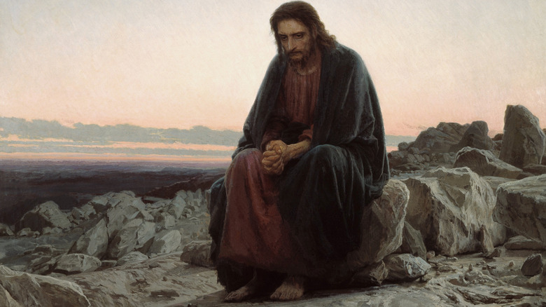 Jesus leans forward in contemplation