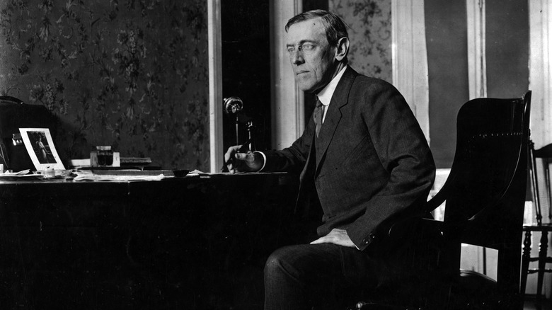 woodrow wilson sitting at desk