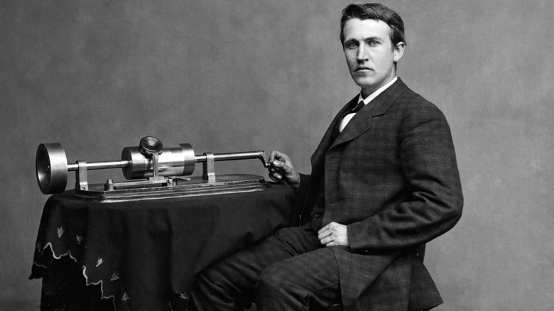 Thomas Edison next to invention