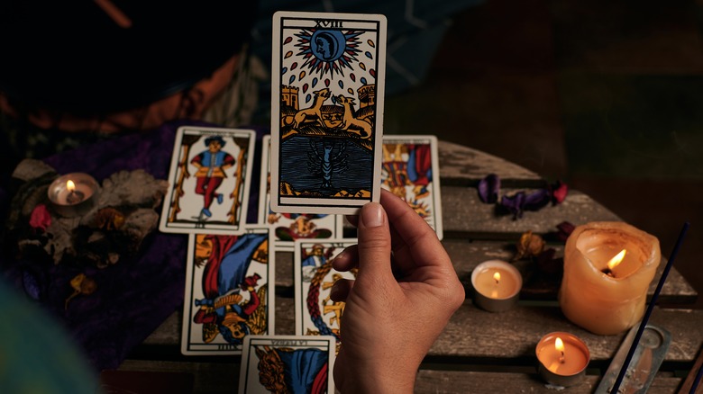 A fortune teller reading tarot cards