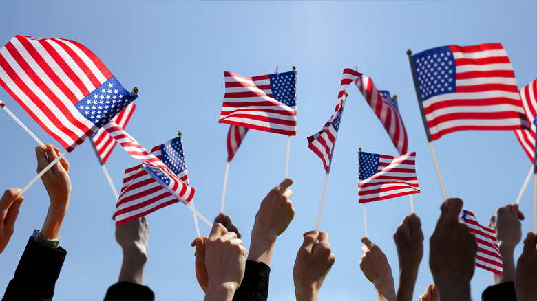 people waving American flags