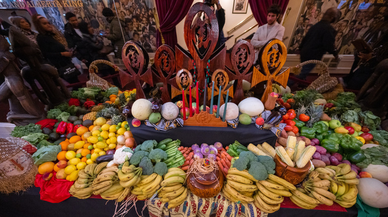 Kwanzaa display shows fruits and vegetables