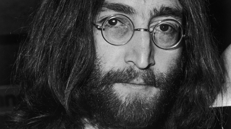John Lennon glasses serious expression
