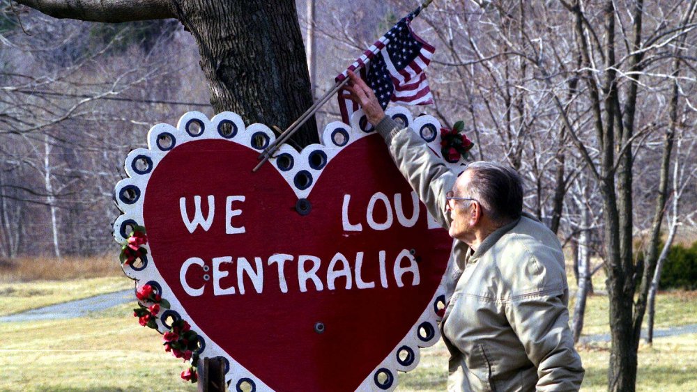 The mayor of Centralia with a sign