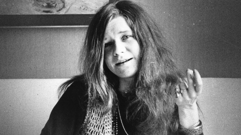 Janis Joplin posing for photo