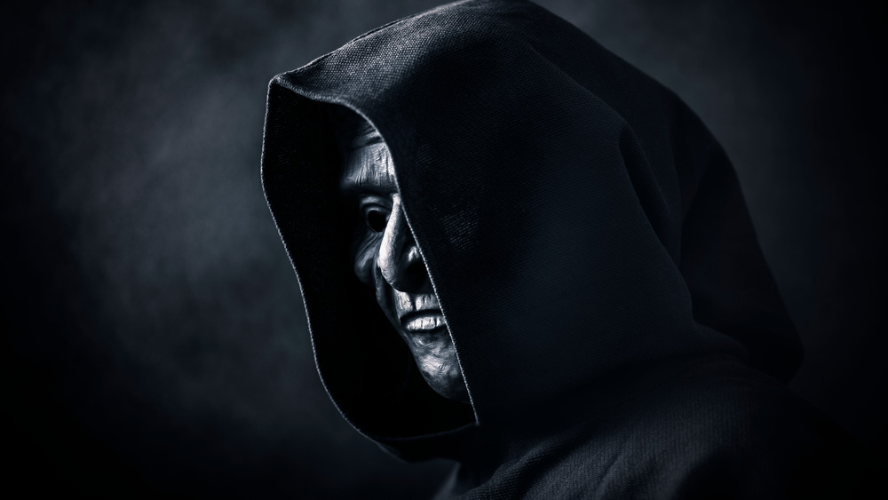 masked man in a black hood