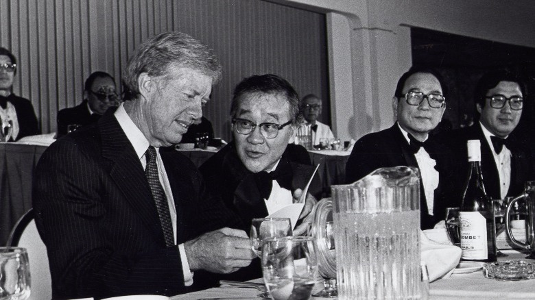 Jimmy Carter Joji Konoshima sitting table speaking