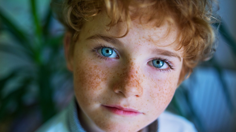 boy with blue eyes red hair