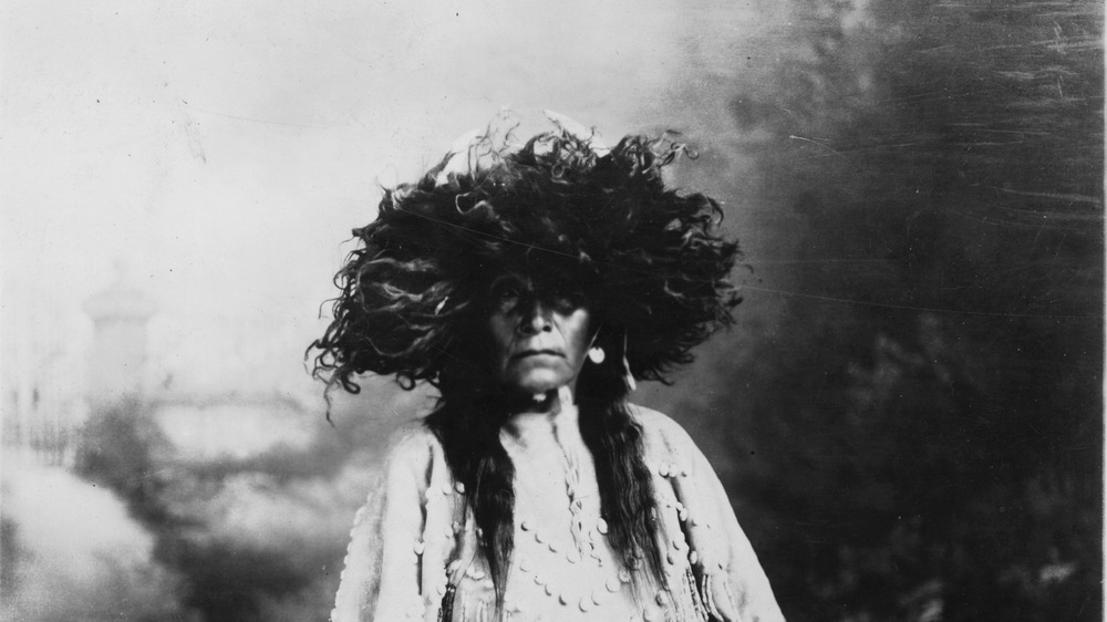 A female Shaman with bushy headdress