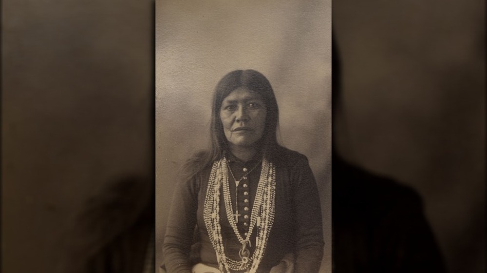 Portrait of Geronimo wearing feather headdress