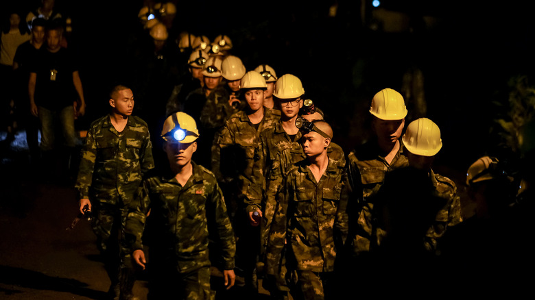 rescue team in yellow hats lined up