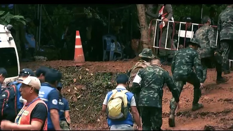 rescuers entering flooded tunnel