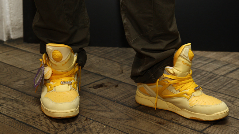 person wearing Reebok Pumps