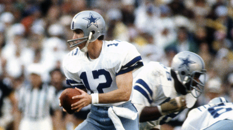 Roger Staubach holding football