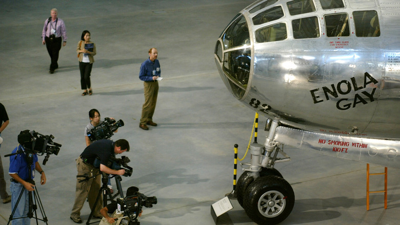 Camera crews snap the Enola Gay