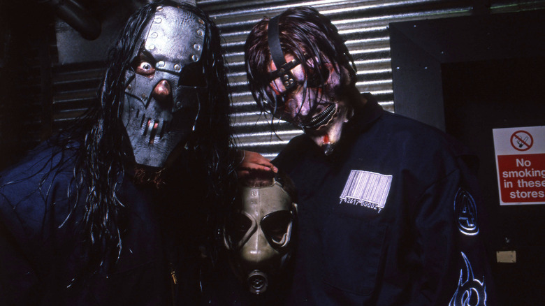 Mick Thomson, Sid Wilson and Jim Root backstage