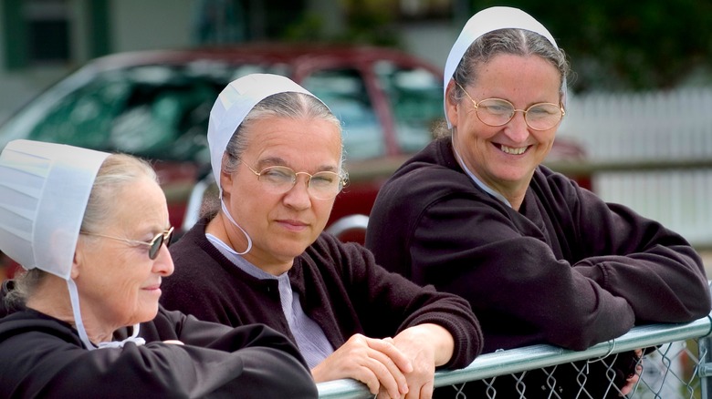 Amish women smiling and hanging out