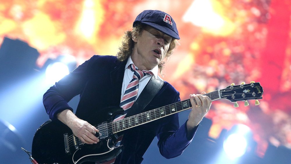 Angus Young in schoolboy uniform