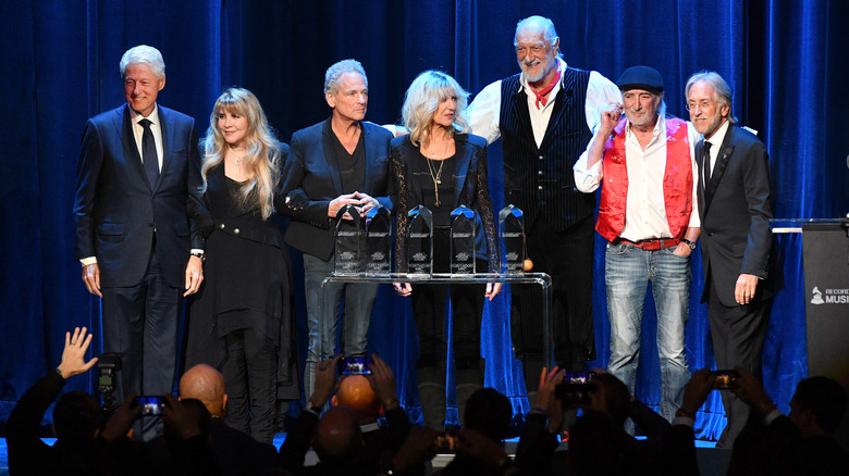 Fleetwood Mac posing with Bill Clinton