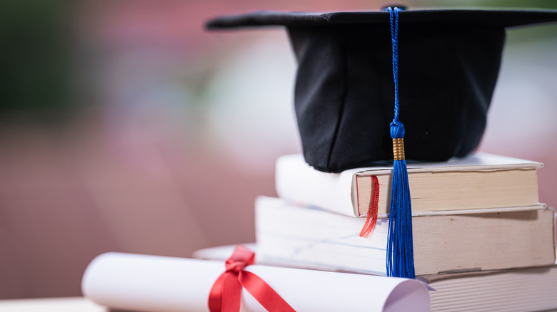 Mortar board on top of books