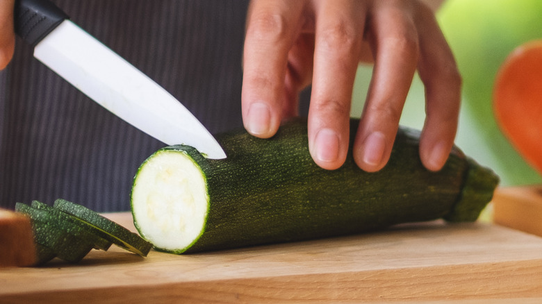 chopping zucchini