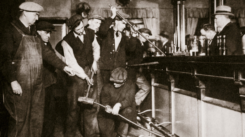 Prohibition agents dismantling bar