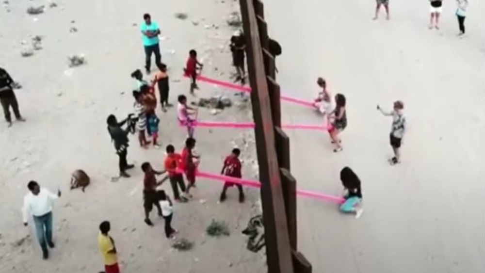 Kids play Teeter Totter Wall