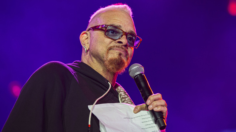 Sinbad performing on stage in sunglasses