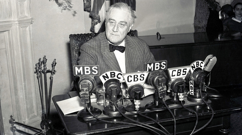 Franklin D. Roosevelt giving fireside chat on radio