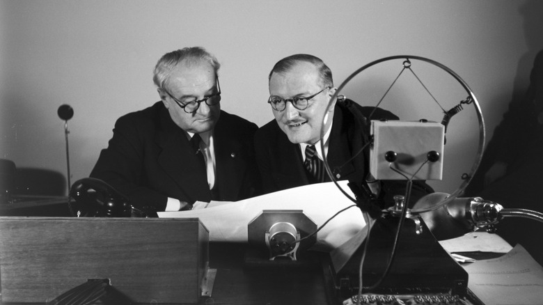 journalists broadcasting radio program