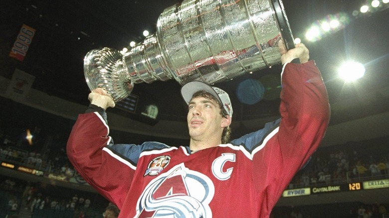 Joe Sakic lifting the Stanley Cup