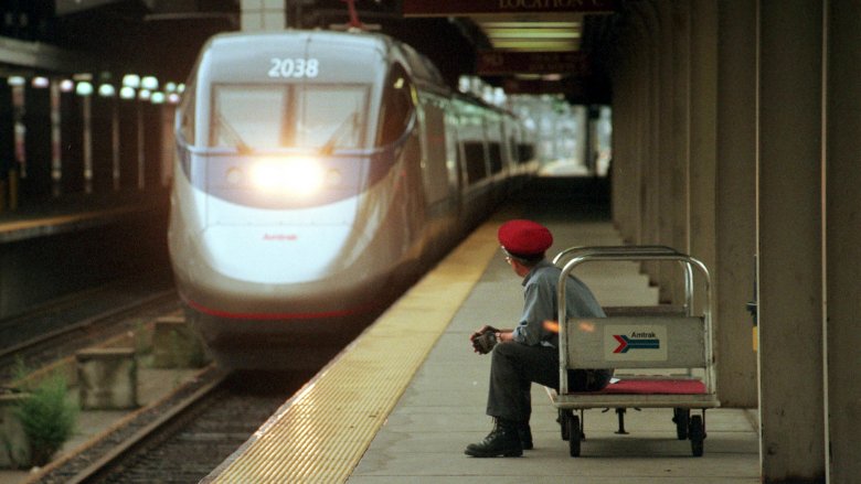 amtrak acela slow usa worker waits for train