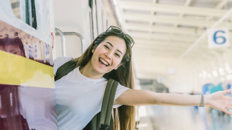 happy female train passenger