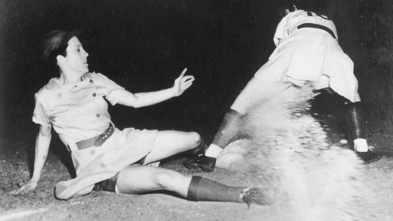 Dorothy "Dottie" Kamenshek slides into base