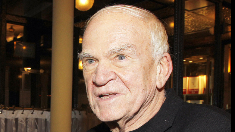 Milan Kundera in black shirt with grey hair