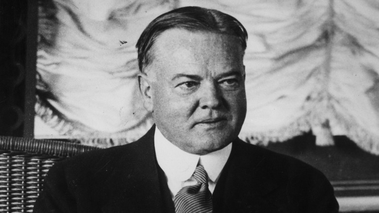 Herbert Hoover seated in suit