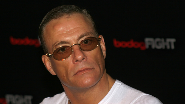 Jean-Claude Van Damme wearing glasses