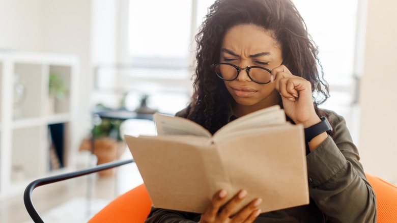 a Black woman reading