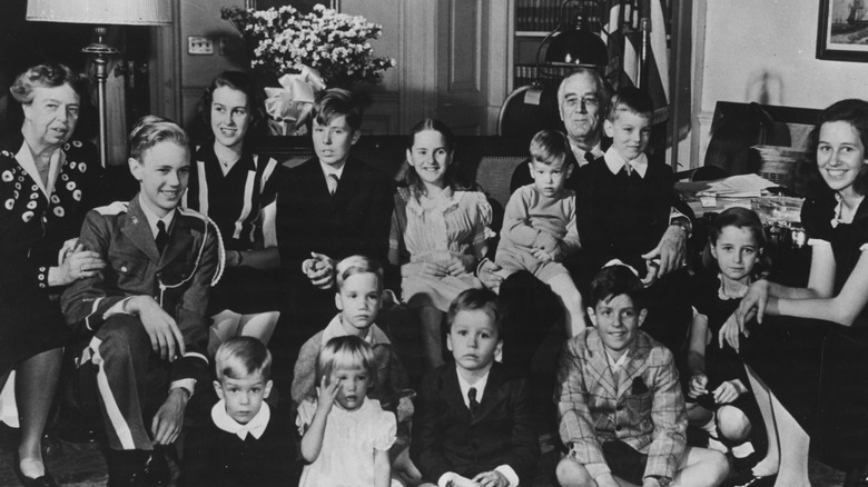 Franklin and Eleanor Roosevelt pose with their many grandchildren