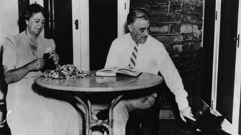 Franklin and Eleanor Roosevelt relaxing with their dog