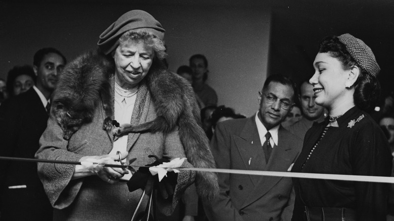 Eleanor Roosevelt cutting a ribbon